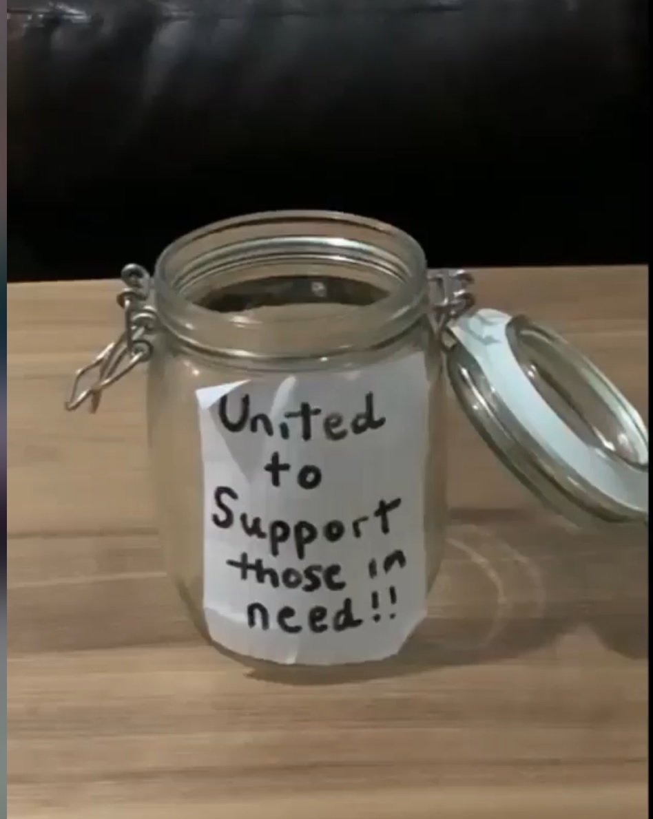 A donation jar labelled United to Support those in need